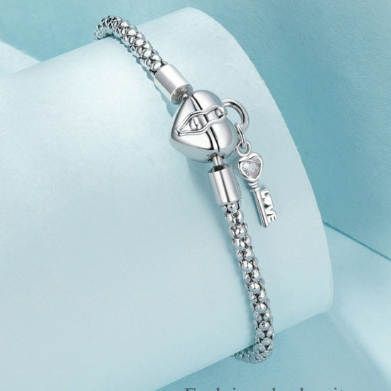 Braccialetto con base a chiave e lucchetto a cuore