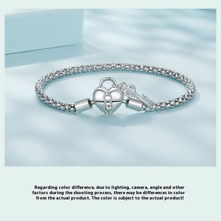 Braccialetto con base a chiave e lucchetto a cuore